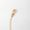 Close-up of a gold-plated chain with a lobster clasp, designed as part of the Necklace Extender - Gold for adjustable fine jewellery pieces.