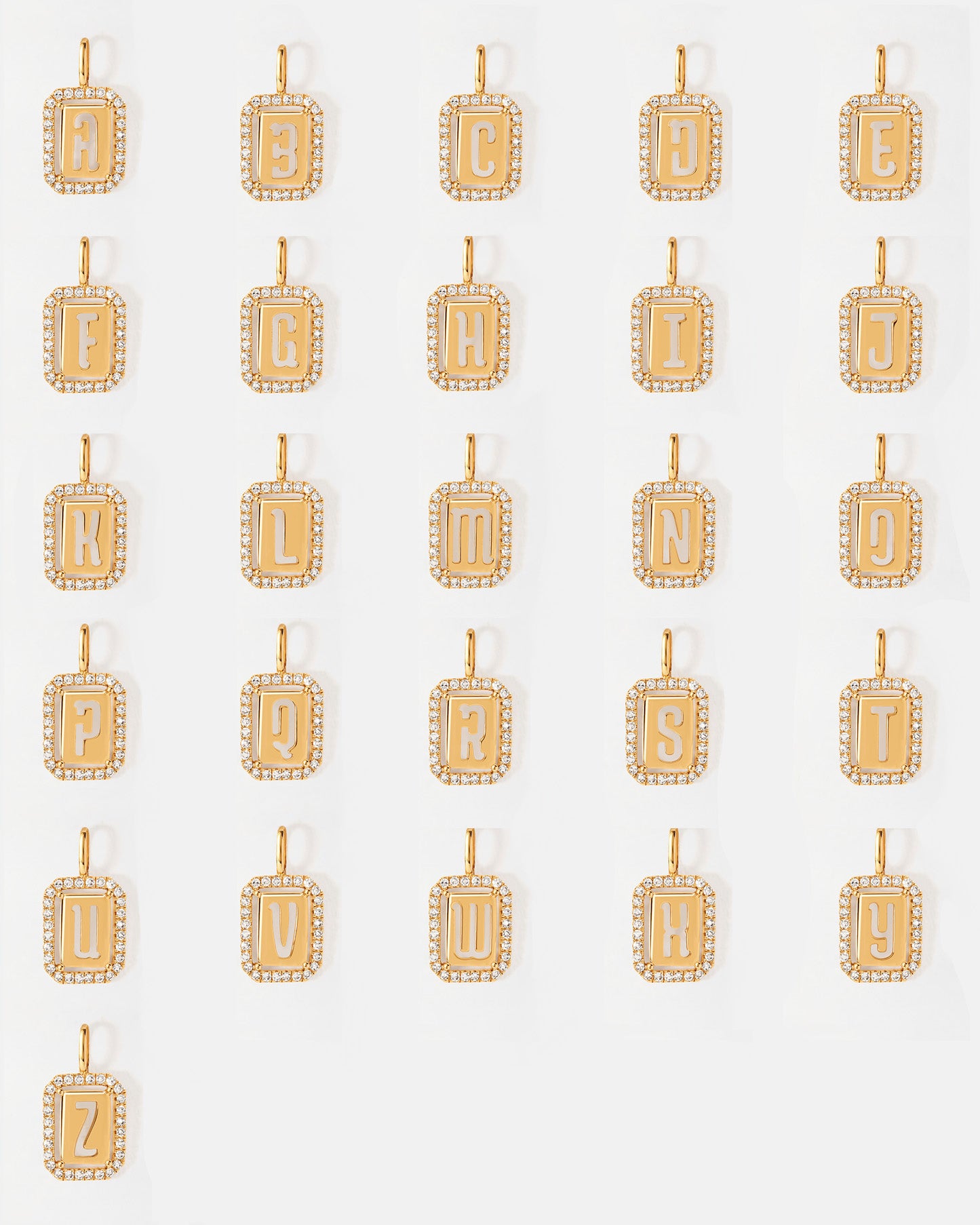 Collection of Diamond Outline Initial Necklaces in solid 14ct gold with lab-grown diamonds, showcasing every letter for personalised, sustainable fine jewellery made in recycled metals.